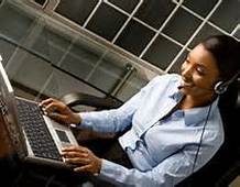 Woman smiling while working at home from  her laptop